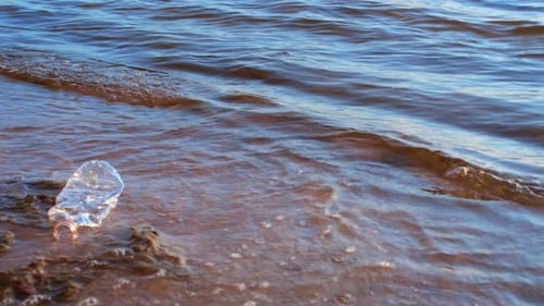 The Plastic Bottle Floating in the Sea Symbolizes the Issue of Marine Environment Pollution By