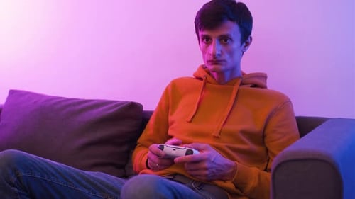 Man on Couch Playing Video Games