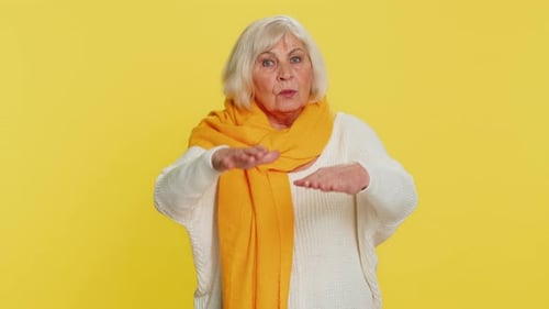 Adult with Gray Hair Speaking and Gesturing