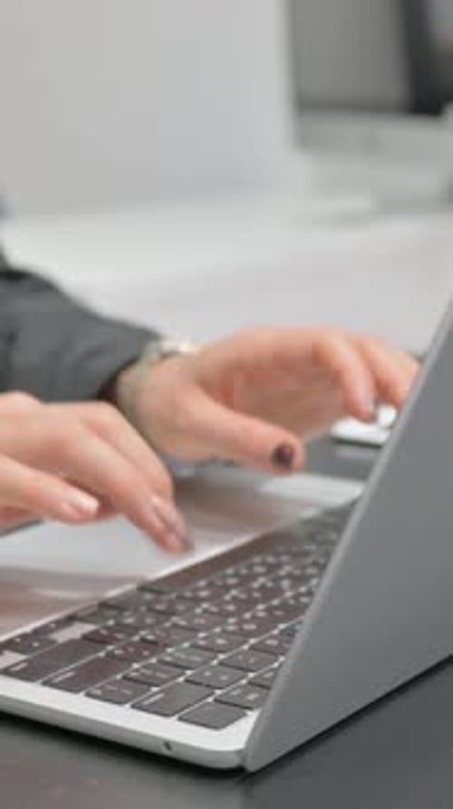 Close up Female Hands Working on Laptop, vertical video