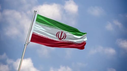 Waving Flag of Iran Against Blue Sky