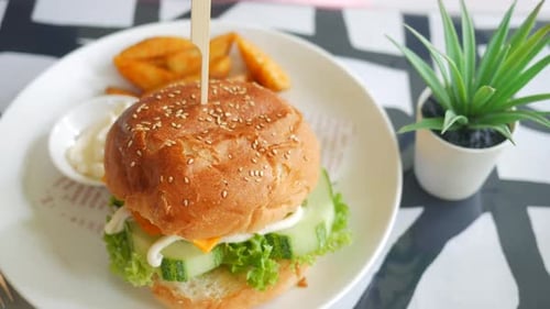 Delicious Burger with Wedge Fries and Sauce