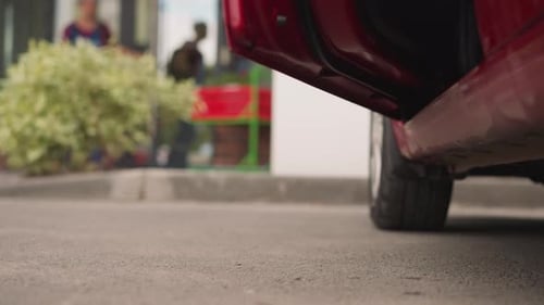Woman in Heels Exiting Red Car