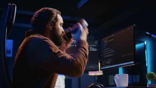 Cheerful Programmer Listening Music During Remote Job Shift