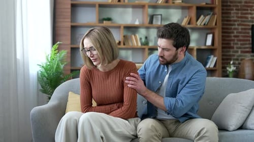 Woman with Stomach Pain Comforted by Caring Partner