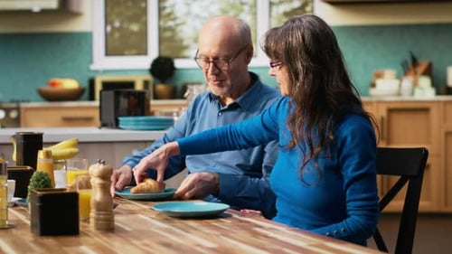 Senior Couple Enjoying a Meal Together at Home