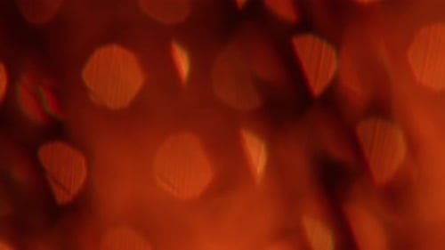 Abstract Background with Amber Light Leaks and Bokeh