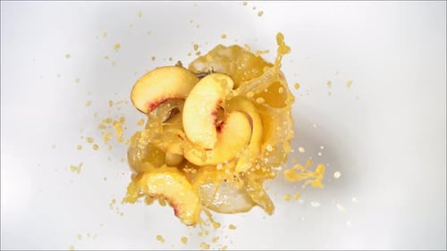 Super Slow Motion of Explosion Peach and Burst Juice and Slices