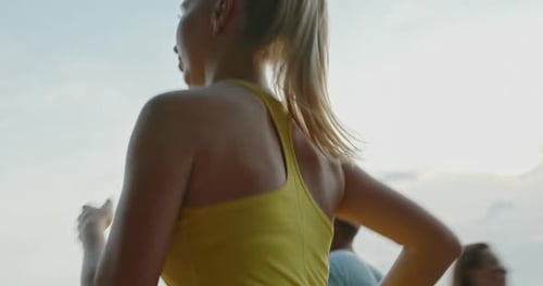 Woman and a Man Run Along the Waterfront Perform Confident Cardio Confidently and Motivatedly Move