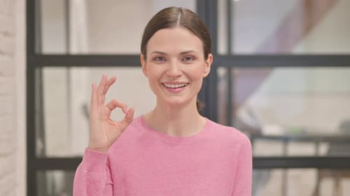Woman Smiling with Ok Hand Gesture Close Up