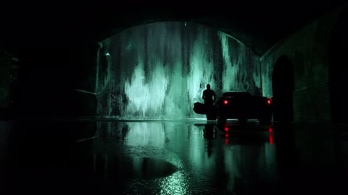 Dark Tunnel Scene with Mysterious Green Glowing Wall and Car