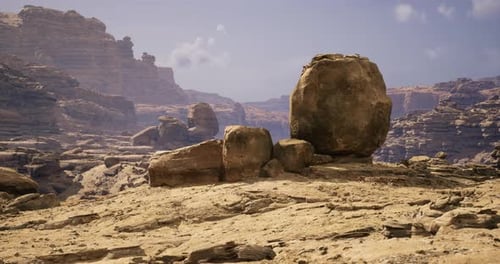 Large Boulder Formation in a Rugged Desert Landscape Under Clear Sky