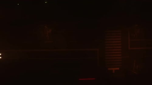 Lonely Car Riding at Night on a Foggy Road in a city, Top Down View.