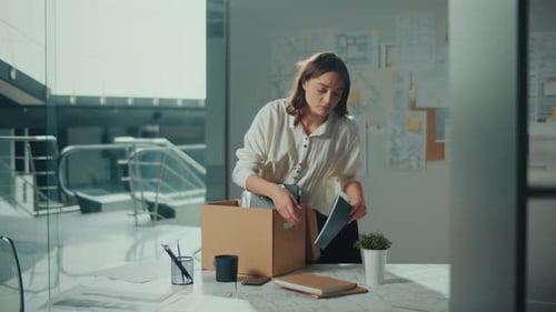 The Woman Was Fired and She is Packing Things in A Box Office Work