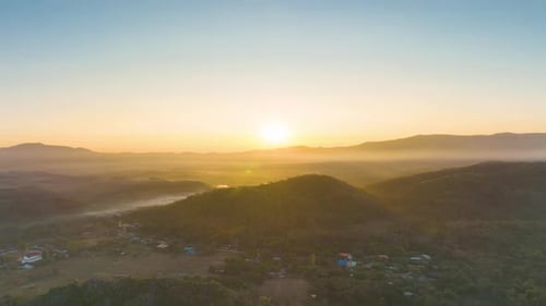 Aerial view Beautiful of morning scenery Golden light sunrise And the mist flows on high mountains.