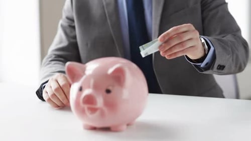 People, Financial Savings, Investing and Economy Concept - Close Up of Businessman