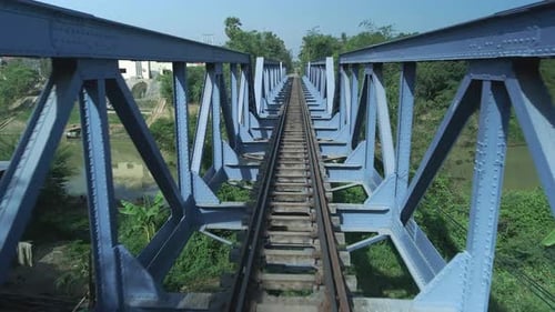 Railway bridge, symmetrical structure drone fast fly through.