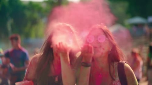 Young Adults Celebrate Holi with Color Powder