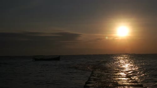 4k timelapse sunset on the pier and fishing boat