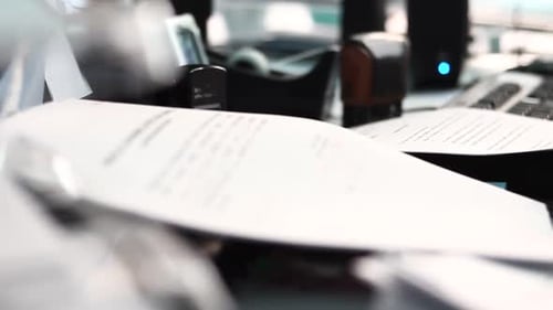 Business in the Office With Papers and Computer