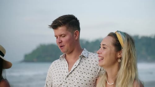 Happy Couple Man Woman Walk on Sunny Tropical Beach with Friends Enjoy Rest Flirt Talk Laugh