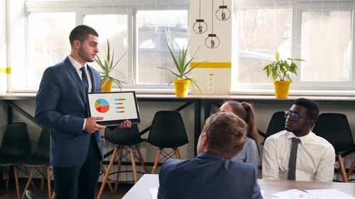 Professional Business Presentation with Colleagues in Office