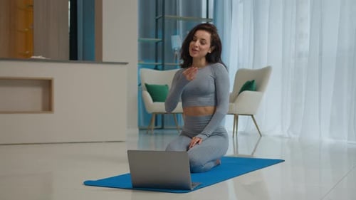 Woman Doing Online Fitness Class at Home