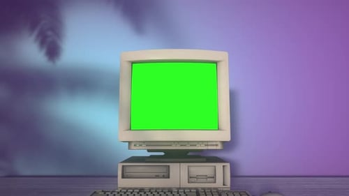 Vintage Retro Personal Computer with Keyboard on a Desktop with Green Screen