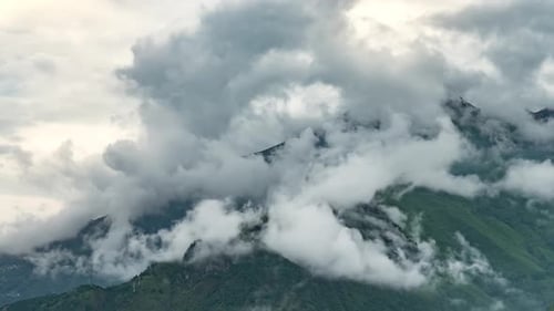 Moving Clouds in the Majestic Green Mountains