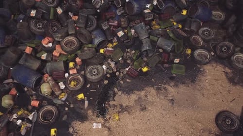 Waste Materials Scattered on the Ground in an Outdoor Dumping Site