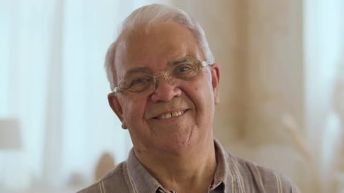 Front View of Happy and Smiling Senior Man Looking at Camera