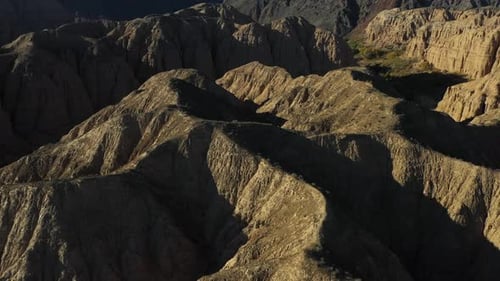 Cinematic flyover drone shot of Charyn Canyon in Kazakhstan, flying close to the rocky cliffs
