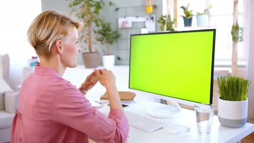 Businesswoman with Computer Having Video Call Indoors in Office Keyable Screen