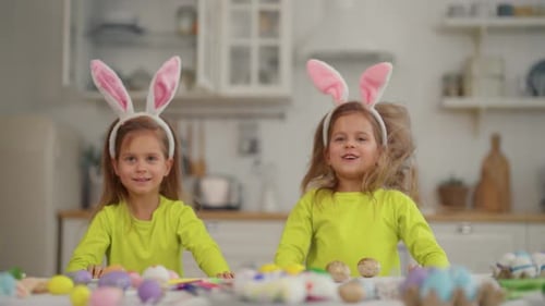 Twin Girls Celebrate Easter Holiday Twins Cheerful Children in Rabbit Bunny Ears Jump Out From the