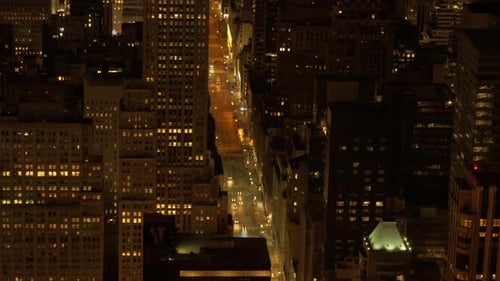 aerial view of city and traffic at night. illuminated street scene