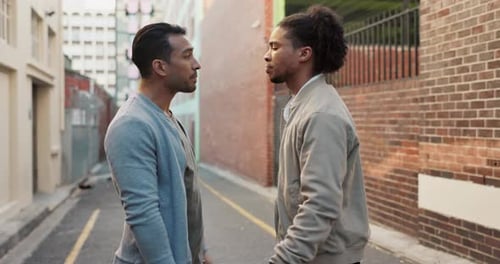 City, confrontation and men in street fight with violence, battle and disagreement with conflict