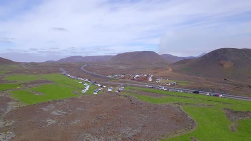 Aerial View Of Vehicles Parked, Geldingadalir Valley In Iceland - drone shot
