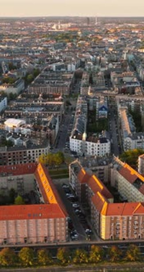 Aerial drone view of Vesterbro district in Copenhagen, Denmark at sunset. Vertical