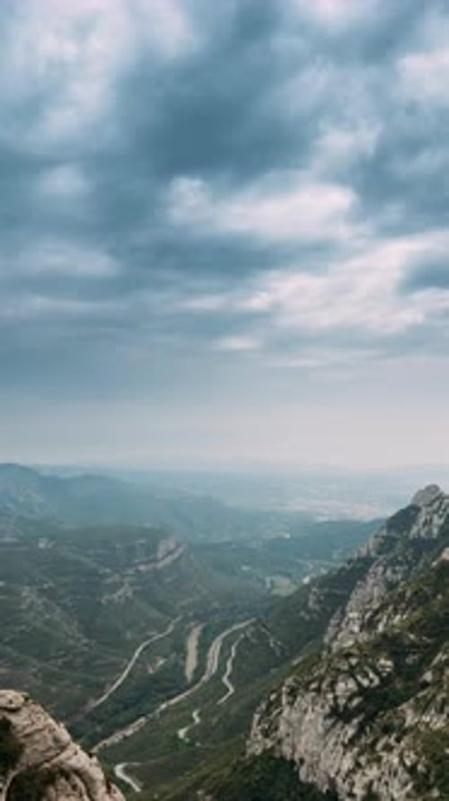 Aerial View of Mountains and Winding Road
