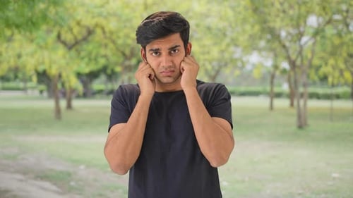 Guilty Indian boy saying sorry and apologizing