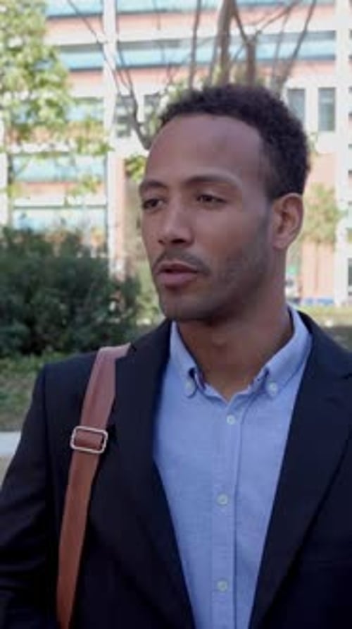 Two Professional Business Colleagues Talking to Each Other Standing Outdoors