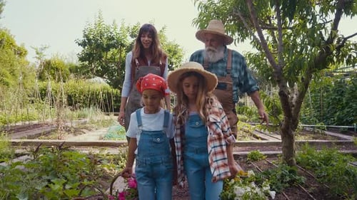 Happy family in a vegetable garden