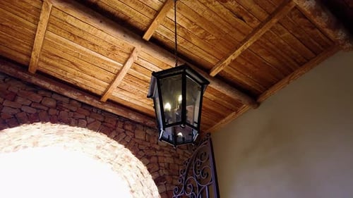 Vintage Lamp Light In The Old Building With Wooden Ceiling. - low angle shot