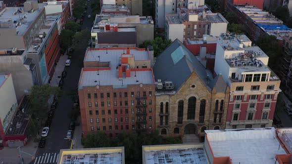 Aerial orbit of apartment rooftops in the Harlem neighborhood of New ...