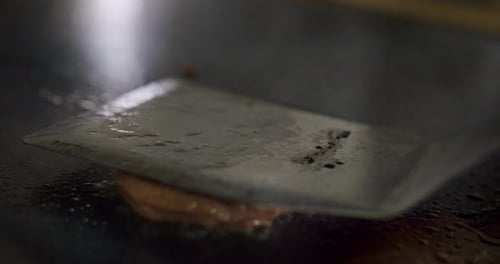 Patty Cooking on a Flat Top Grill