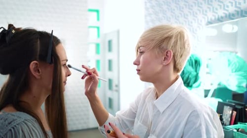 Woman Receives Makeup and Hair Styling in Salon
