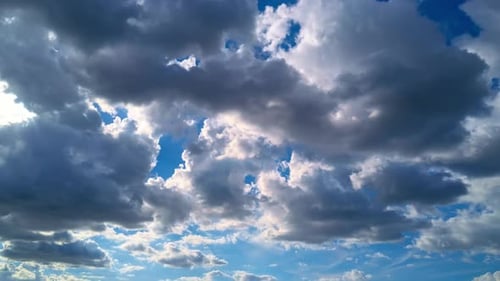Scenic Clouds Flowing in a Sunny Blue Sky