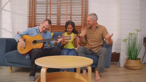Men and Child Playing Guitar at Home
