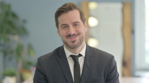 Man In Suit Smiling Portrait in Office