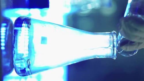 Liquid Being Poured Into a Laboratory Beaker